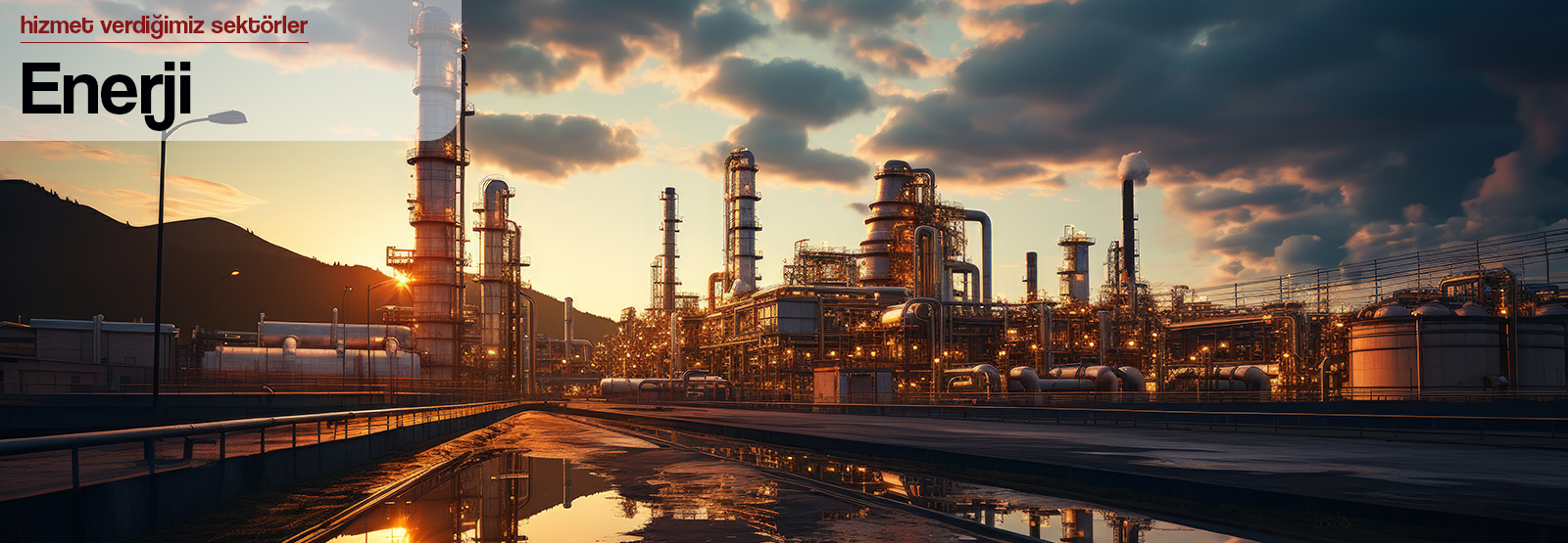 Smokestacks against a clear sky, industrial landscape.